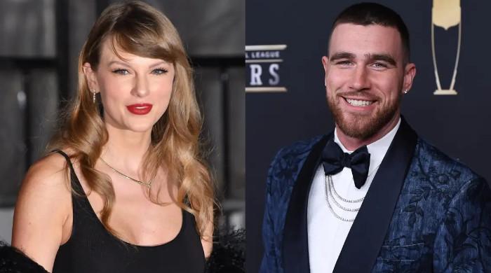 Taylor Swift brings Travis Kelce on stage in surprise appearance